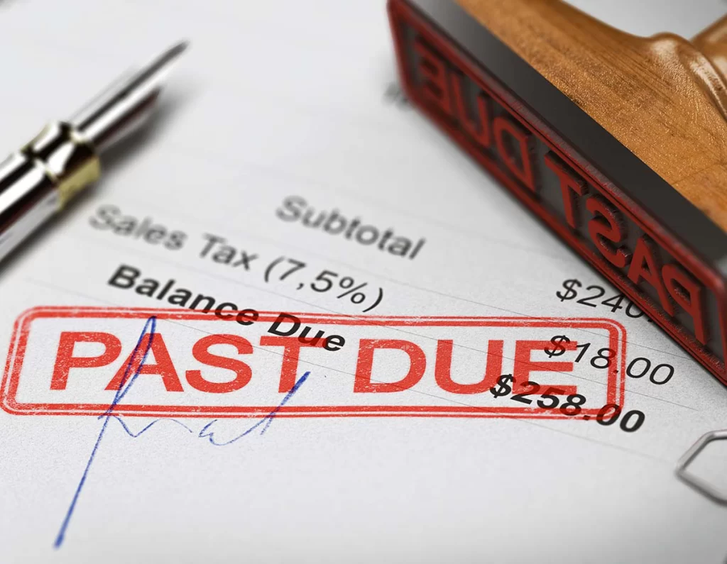 An invoice with a red "Past Due" stamp on it
