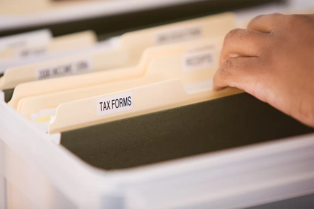 Employee sorting through tax files
