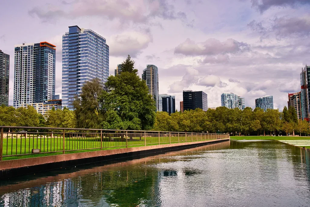 Landscape shot of Portland skyline with water feature in the forefront.