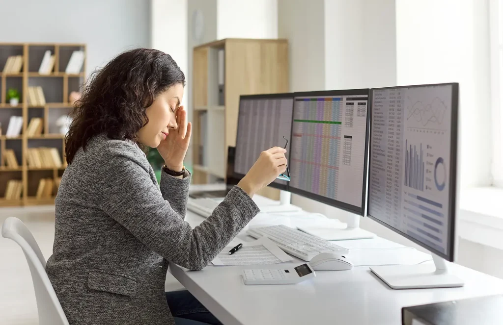 Woman doing bookkeeping and stressing